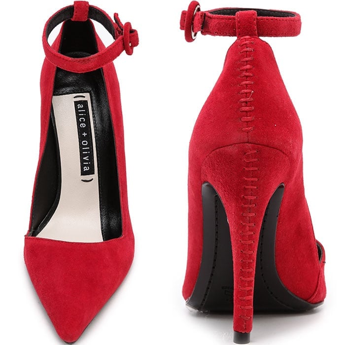 Exaggerated stitches flow down the covered heel, and a buckle secures the ankle strap