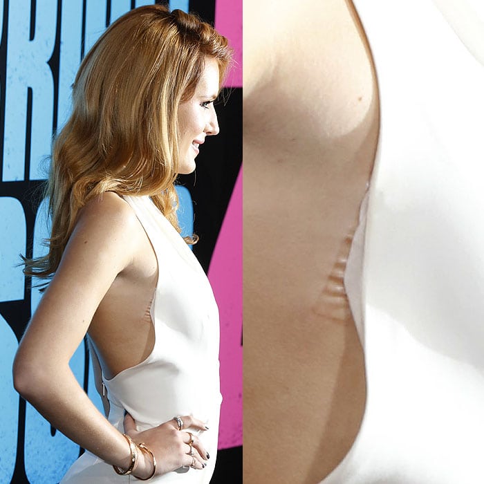 Wardrobe Malfunction: Double-sided tape peeling off the side of Bella Thorne's Gucci halter jumpsuit