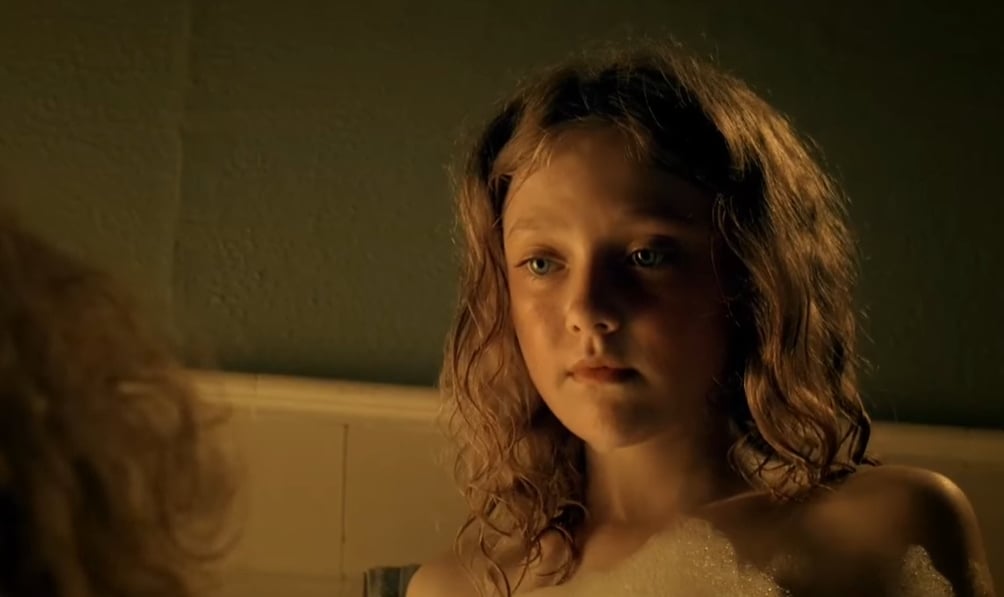 Dakota Fanning portrays the troubled character Lewellen in a powerful scene from the 2007 film Hounddog