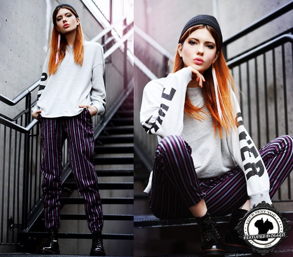 Ebba wears vertical striped pants with a statement sweater