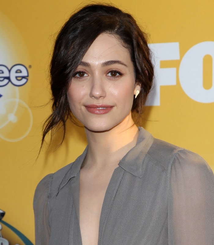 Emmy Rossum shows off a soft, tousled updo paired with natural makeup and a subtle nude lip at Fox’s Cause for Paws: An All-Star Dog Spectacular