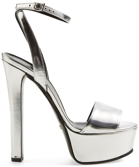 The bold platform style strikes a pose with a silver metallic finish and a flattering, ankle-wrap strap