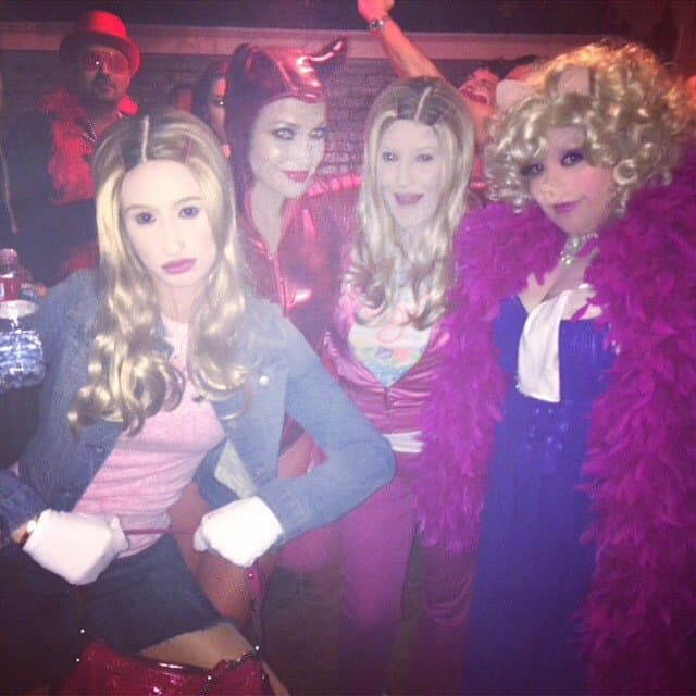Iggy Azalea strikes a pose in her White Chicks costume alongside Jennifer Lopez and friends at a Halloween party