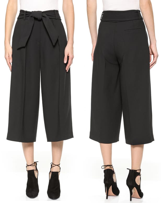 These creased ISSA trousers have modern proportions with a cropped, wide-leg profile