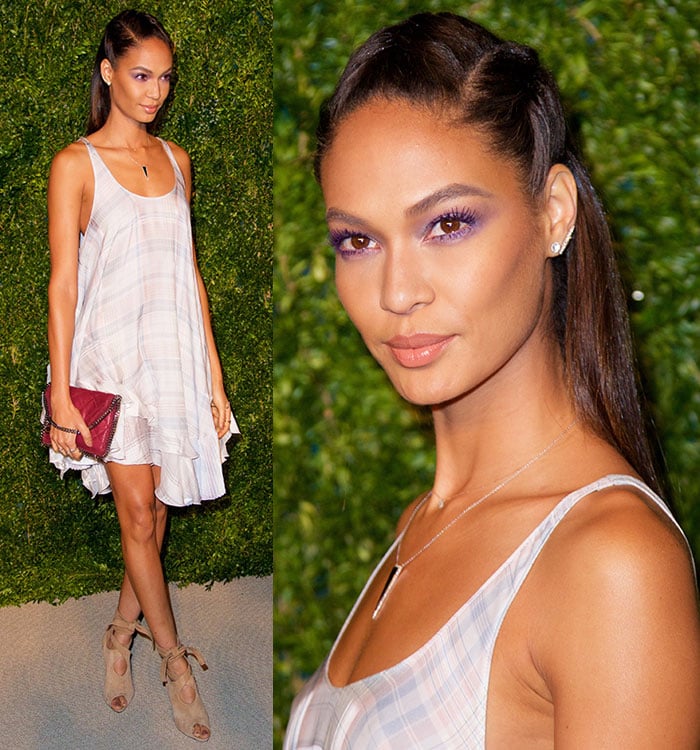 Joan Smalls' hair was pulled away from her flawlessly made-up face in a braided half up-do