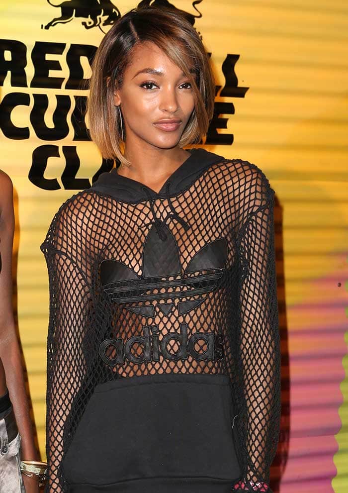 Jourdan Dunn wears a see-through netted hoodie by Jeremy Scott for Adidas