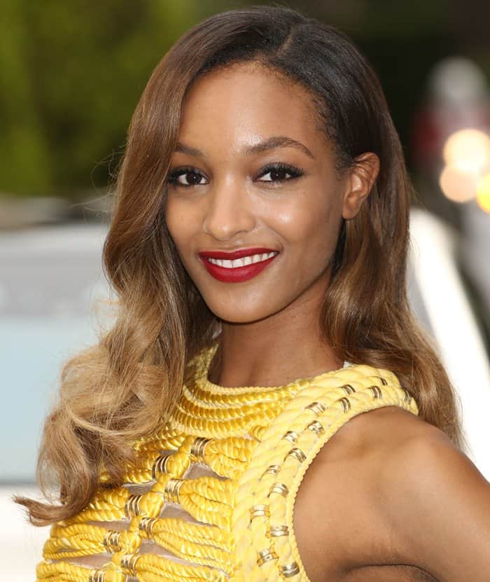 Jourdan Dunn styled her yellow Balmain dress with soft, wavy hair, a bold red lip, and minimal accessories, allowing the intricately designed dress to take center stage at the amfAR Gala