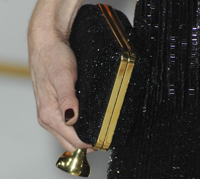 Julianne Moore toting a matching glitter clutch bag