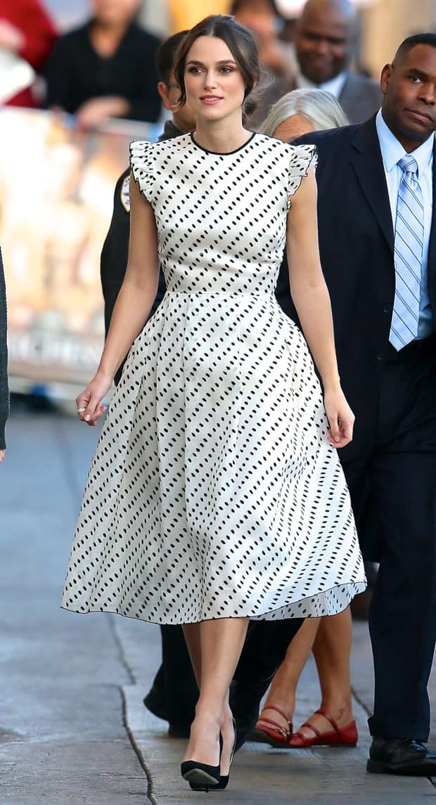 Keira Knightley looked stunning in her tea-length Erdem dress, elegantly showcasing layers of lace and a whimsical design