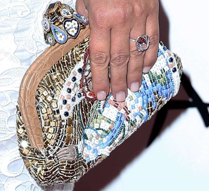 Kim Kardashian toting a bejeweled clutch