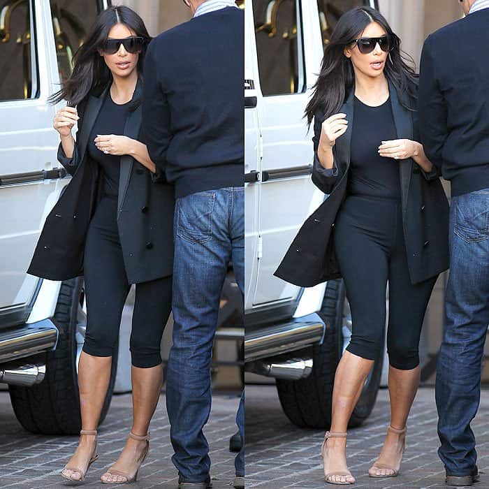 Kim Kardashian arriving at the Montage Beverly Hills Hotel, sporting black cropped leggings, a black bodysuit, a long black blazer, and Alexander Wang "Antonia" sandals