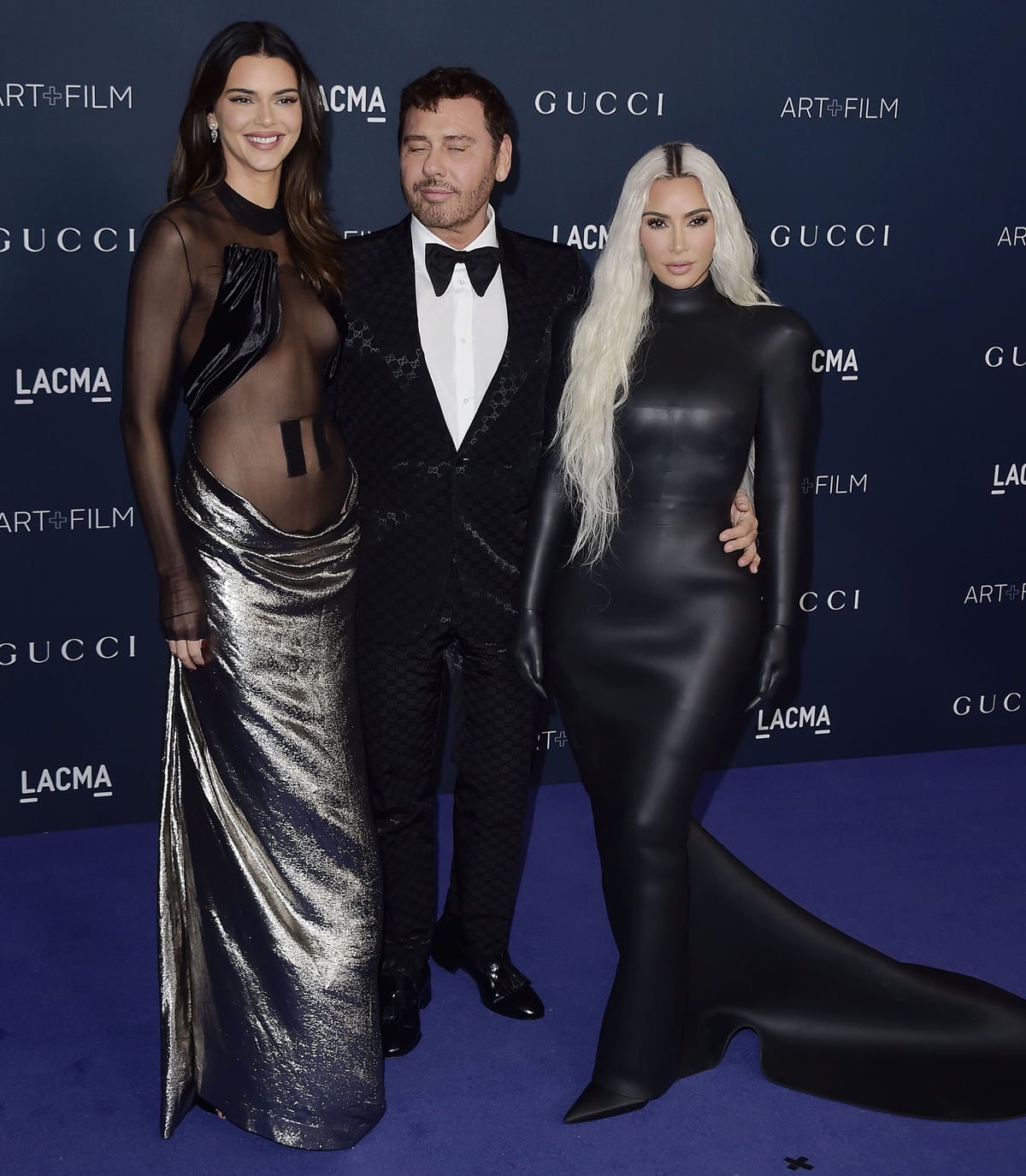 Kendall Jenner, approximately 5 feet 9.25 inches (175.9 cm) tall, is about 7.75 inches (19.4 cm) taller than Kim Kardashian, who is also shorter than the Turkish-born fashion photographer Mert Alas