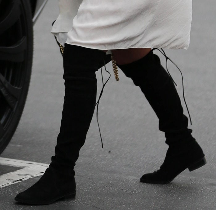 Kourtney Kardashian wearing Stuart Weitzman boots