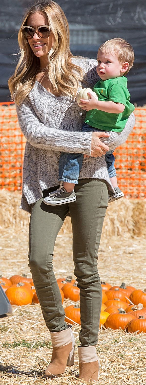 Kristin Cavallari in a cropped cable knit sweater and green pants