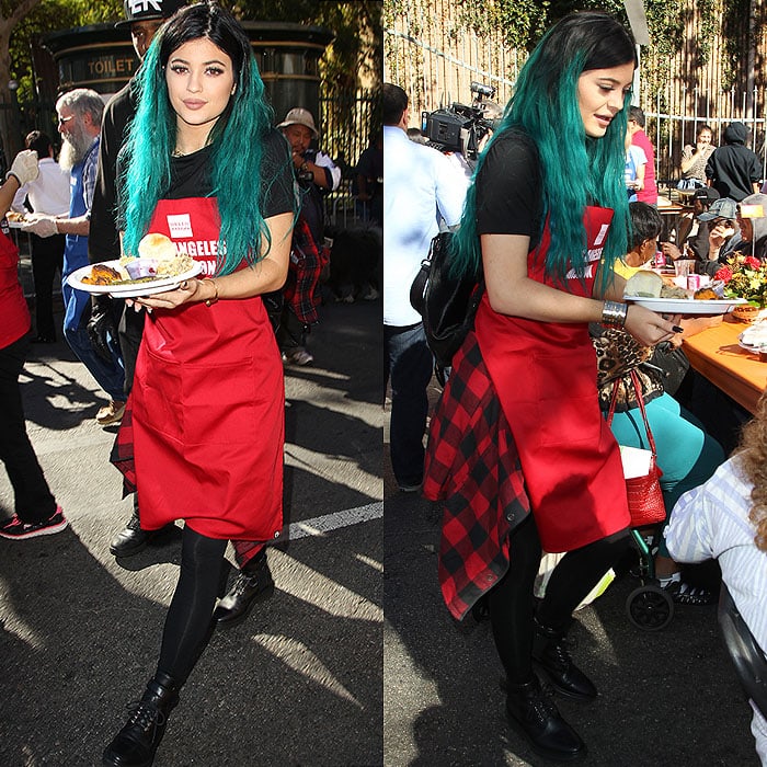 Kylie Jenner distributing meals of traditional Thanksgiving dishes at the Los Angeles Mission's Thanksgiving Meal for the Homeless event