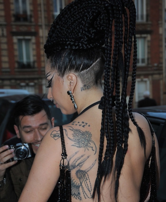 Lady Gaga shows off a shoulder tattoo of three daisies