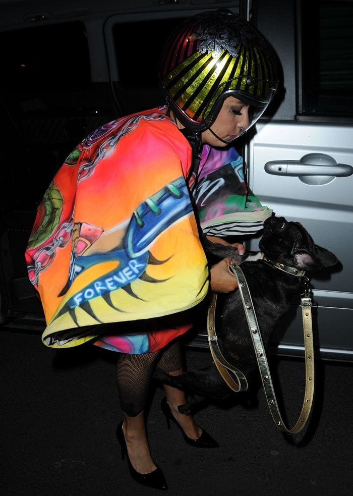 Lady Gaga styled the colorful ensemble with a striped crash helmet and black pointy-toe pumps