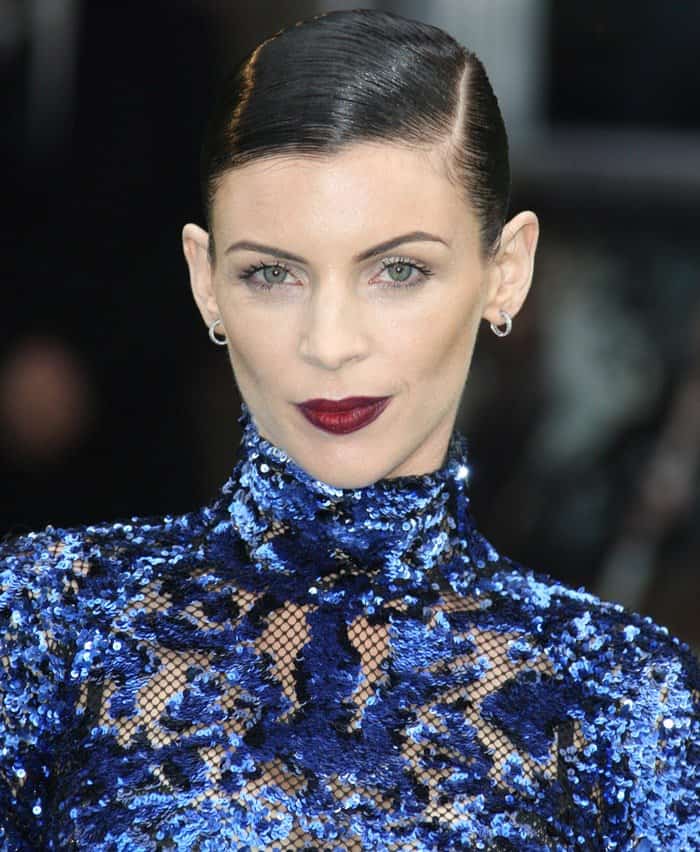 Liberty Ross styled her blue sequin Tom Ford gown with a sleek, side-parted hairstyle and bold dark red lipstick