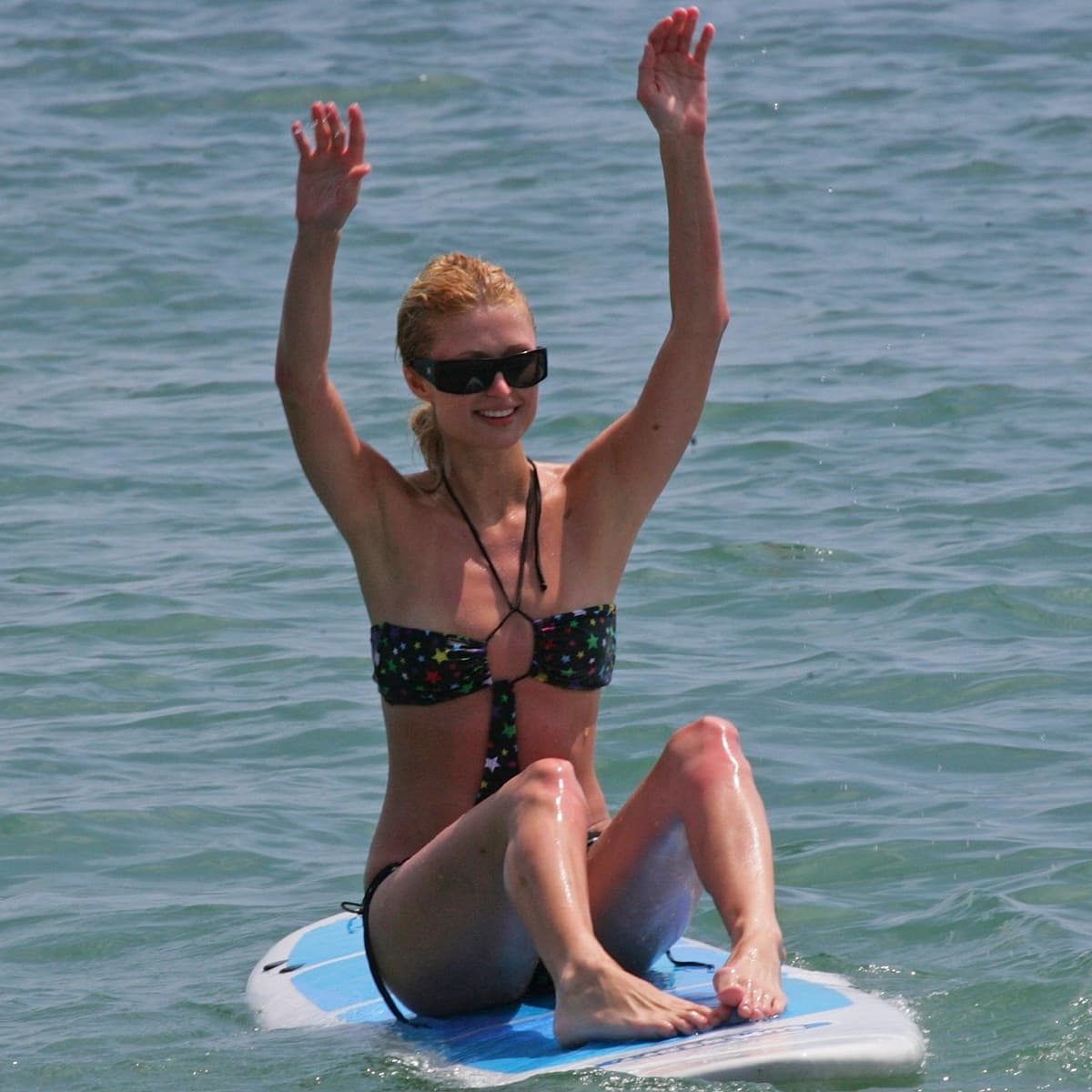 Paris Hilton attempts to surf at Malibu Beach Malibu, California, on July 15, 2007