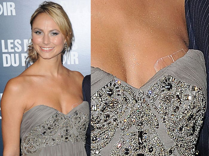 Stacy Keibler's dress started slipping off one side, revealing her boob tape, though she quickly readjusted herself and fixed the situation at the premiere of The Descendants