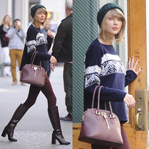 Taylor Swift in oxblood red jeans, beanie hat, jumper, and knee-high boots in New York on November 13, 2014