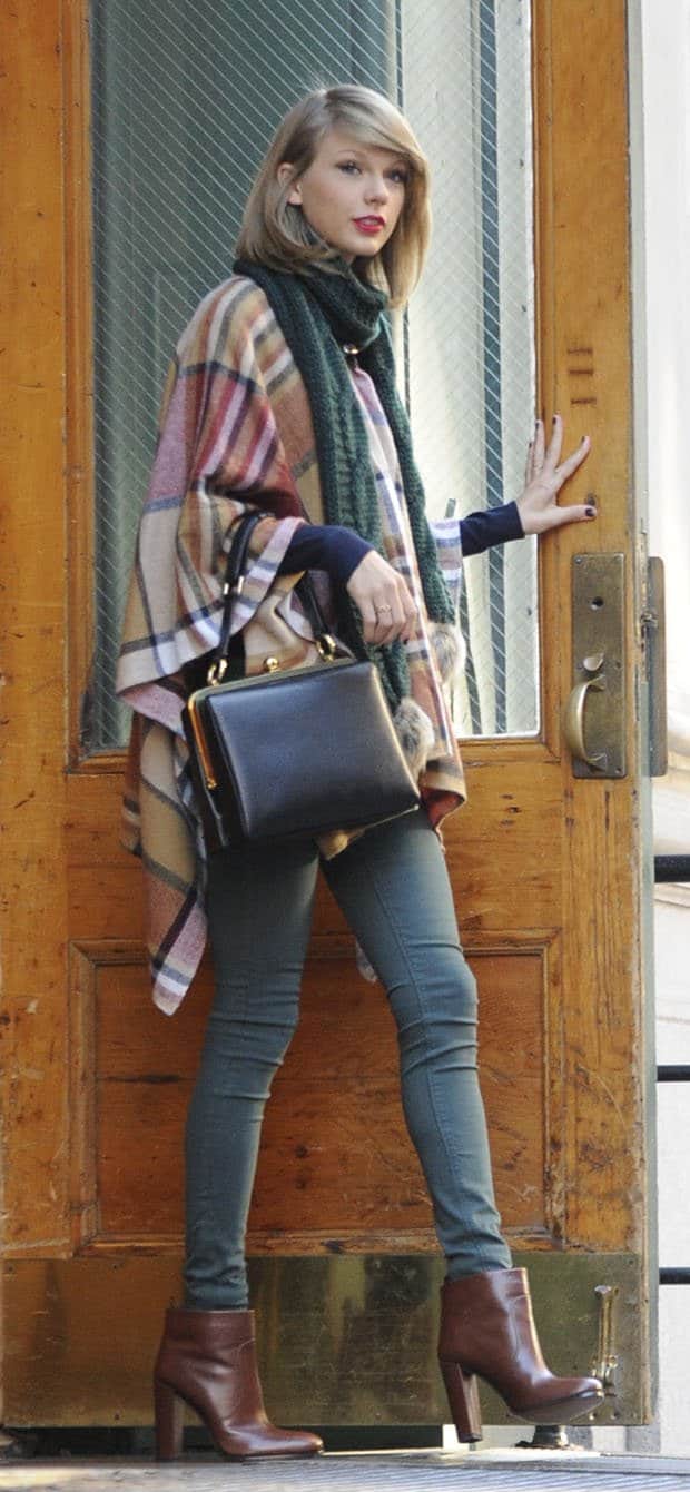 Taylor Swift in a checkered poncho over skinny pants
