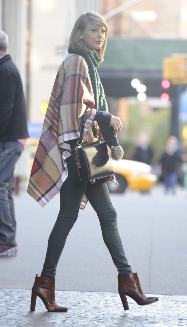 Taylor Swift in jeans and boots leaving her New York apartment on November 14, 2014
