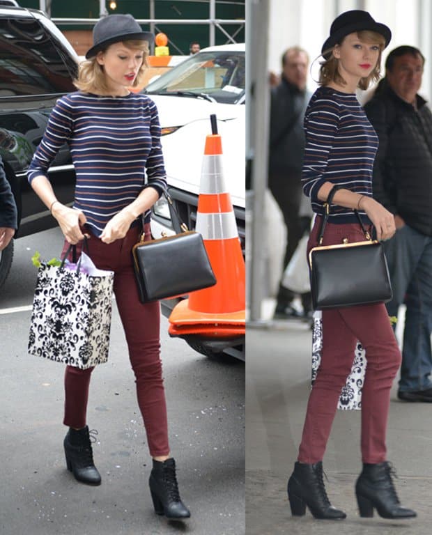 Taylor Swift in a fedora hat and jeans running errands in New York City on April 29, 2014
