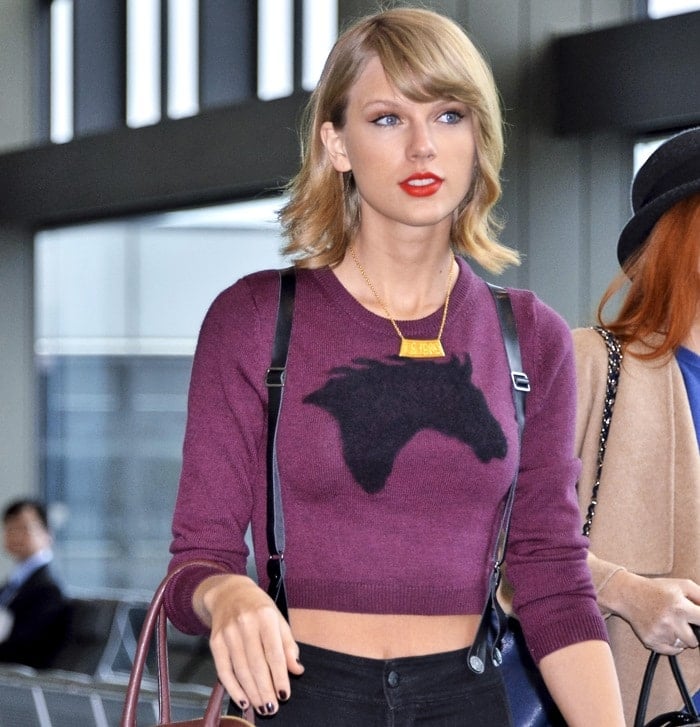 Taylor Swift flaunting her toned midriff in a merino wool "Steel" cropped sweater by Sunday Best
