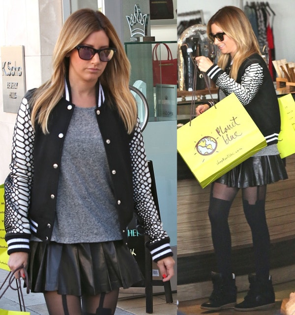 Ashley Tisdale looked edgy and chic in a black and white varsity jacket with croc-print sleeves