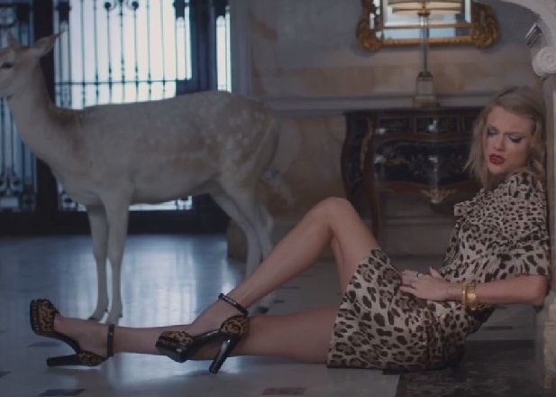 Taylor Swift getting animalistic in two doses of leopard as she goes insane over her leading man in the music video for "Blank Space"
