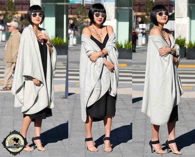 Tina elegantly matches a sleek LBD with sandals and a stunning Cuyana cape