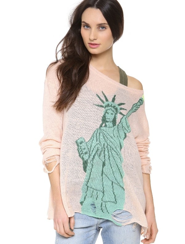 Lady Liberty lights up a relaxed loose knit sweater