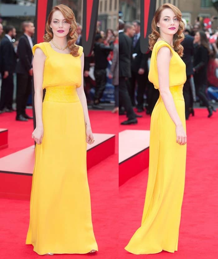 At the world premiere of The Amazing Spider-Man 2 in London on April 10, 2014, Emma Stone wore a stunning yellow Atelier Versace pleated open-back custom gown featuring Swarovski crystals and paired it with a David Webb 18k yellow gold double lion necklace and red lipstick, exuding full feminine, retro glamour