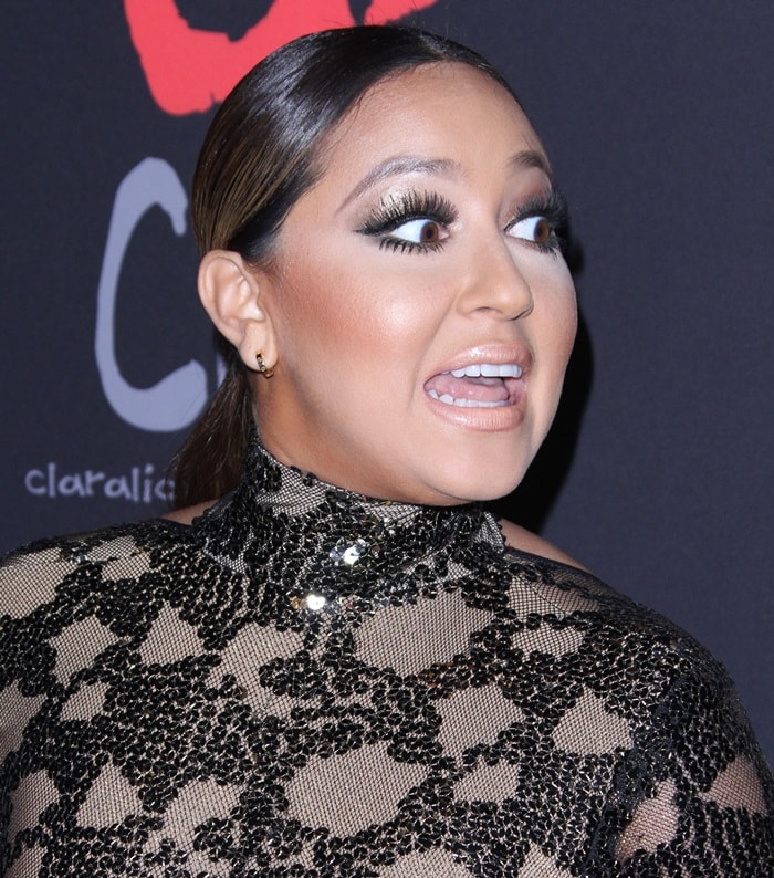 Adrienne Bailon makes a surprised expression on the red carpet at Rihanna's Diamond Ball