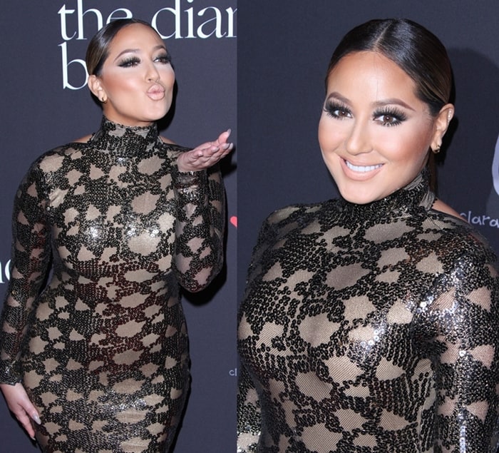 Adrienne Bailon poses on the red carpet at Rihanna's Diamond Ball, showcasing her sequined dress with a distressed pattern