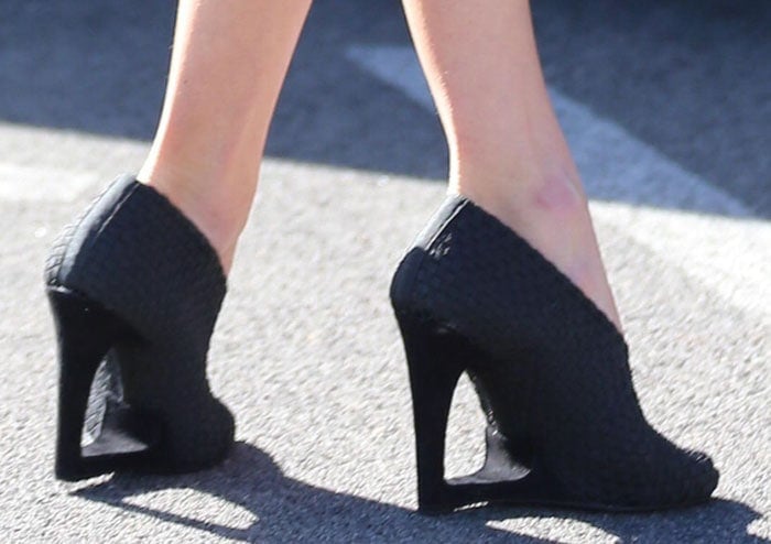 Behati Prinsloo wears woven cutout wedge pumps