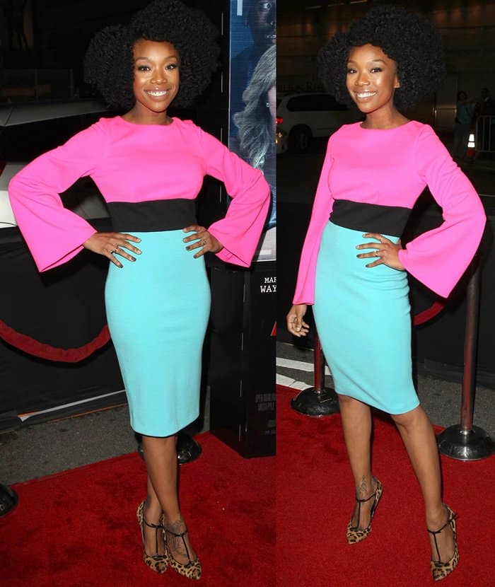 Brandy Norwood stunned in a Fausto Puglisi color-block dress featuring a pink top, black waistband, and turquoise skirt, paired with leopard-print T-bar pumps at the 'Haunted House 2' premiere