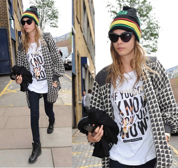 Cara Delevingne in London casually dressed in a beanie hat and a trendy Lamis Khamis T-shirt