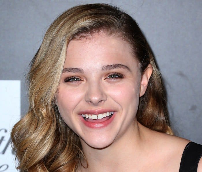 Chloë Grace Moretz beams with a radiant smile at a Los Angeles charity event