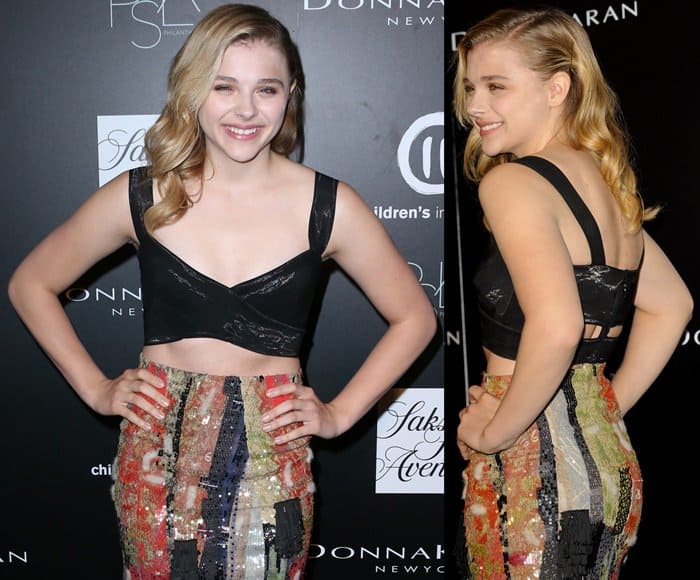 Chloë Grace Moretz dazzles in a shimmering black crop top and a painterly-print pencil skirt at the PSLA Autumn Party in Los Angeles