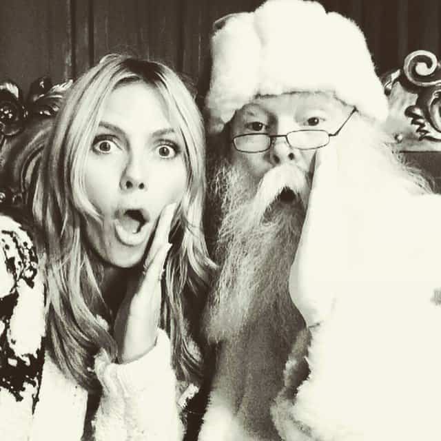Heidi Klum shares a playful moment with Santa Claus at The Grove in Los Angeles