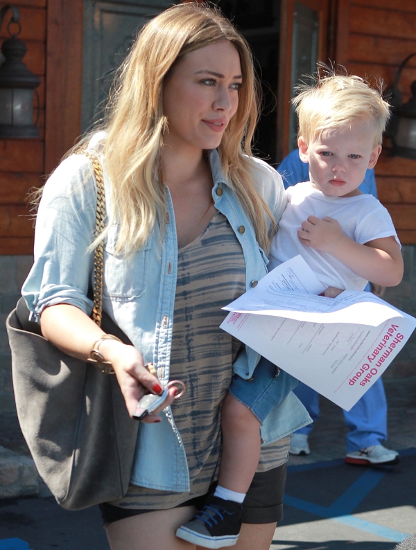 Hilary Duff layered a lightly washed denim button down over a striped top