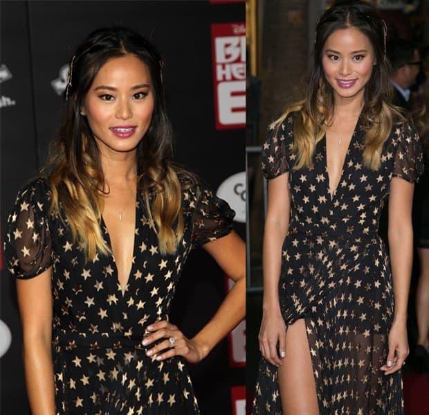 Jamie Chung with soft waves in her hair, adorned with delicate side braids and subtle hair accessories, while her makeup features a fresh, glowing complexion, highlighted with a rosy lip color
