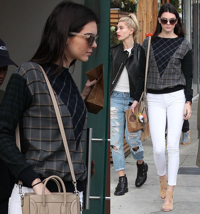 Kendall Jenner showcased her modeling skills in snug white pants, nude peep-toe heels, and a cheery checked sweater for a visit to Sprinkles Cupcakes