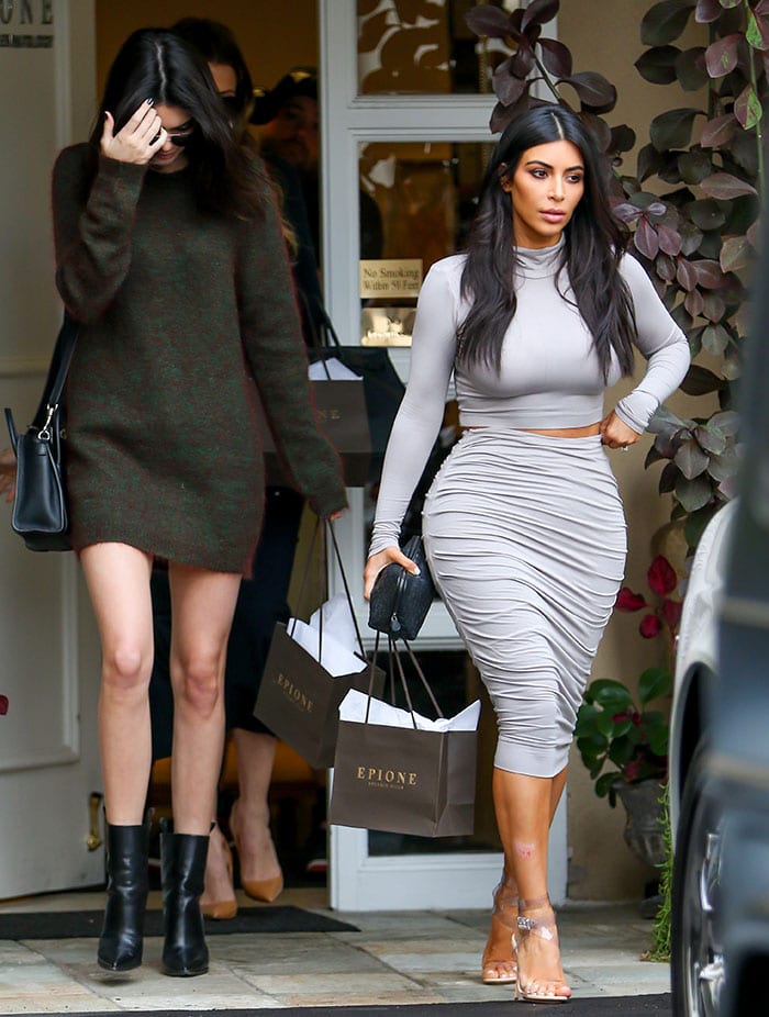 Kendall Jenner flaunts her slender legs in a sweater dress