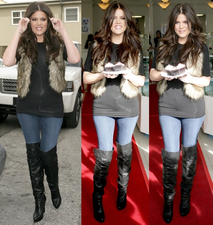 Khloe Kardashian rocks knee-high boots with tight blue jeans, a black t-shirt, and a fur vest