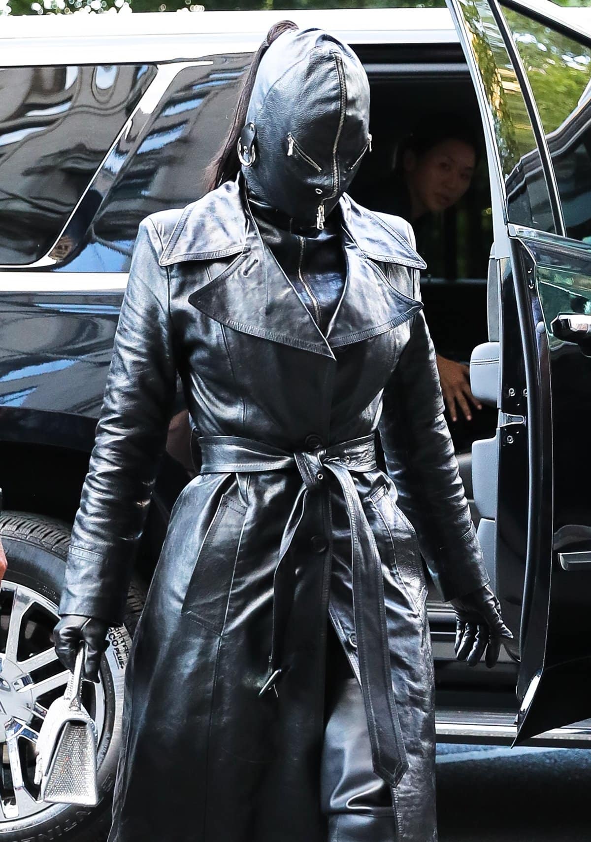 Kim Kardashian covered head to toe with a leather suit