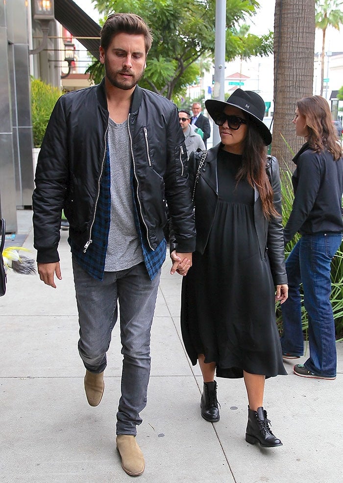 Kourtney Kardashian styled her all-black outfit with a hat and boots