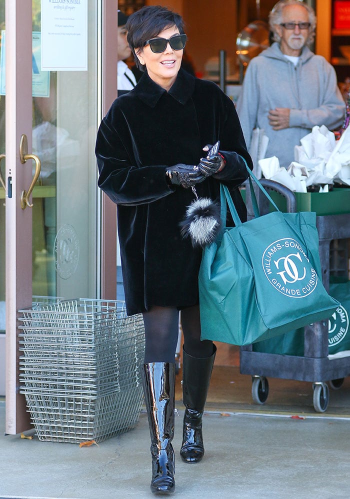 Kris Jenner kept herself warm in a velvety coat, leggings, and gloves after finalizing her divorce settlement